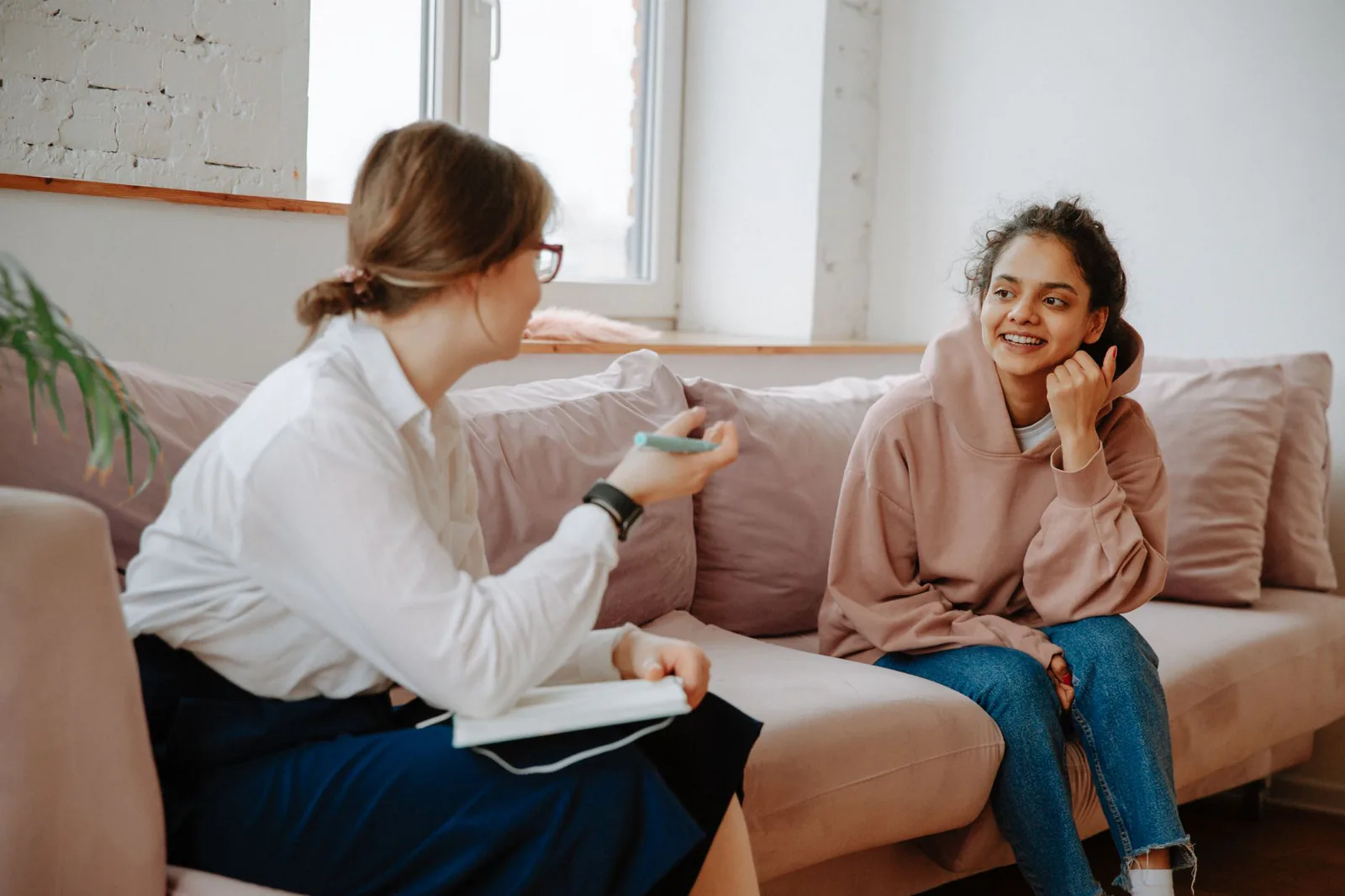 A warm counseling session between a therapist and student