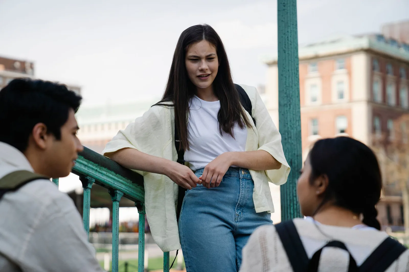 Students having a discussion outdoors on campus
