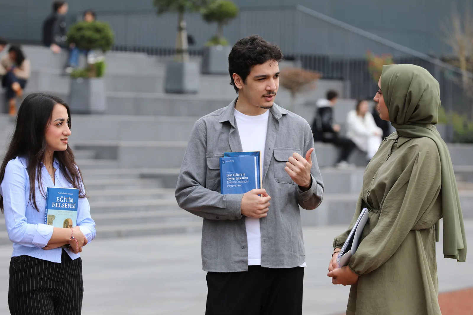 Students meeting on campus stairs