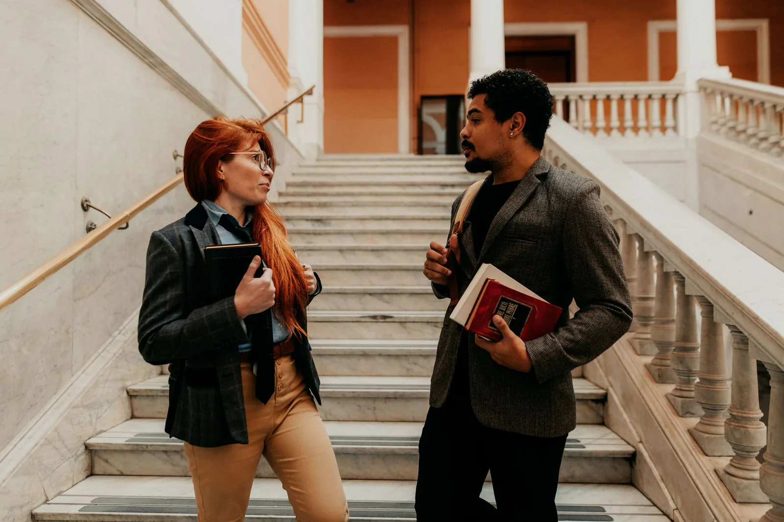 GW students conversing on a campus staircase